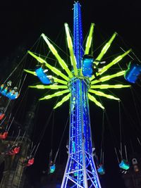 Low angle view of illuminated ferris wheel