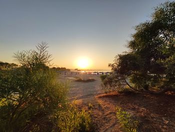 Scenic view of sea against clear sky during sunset