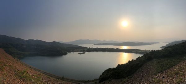 Scenic view of lake against sky during sunset