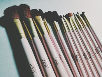 High angle view of pen on shelf against white background