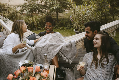 Young people sitting in traditional clothing