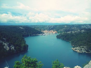 Aerial view of sea against cloudy sky