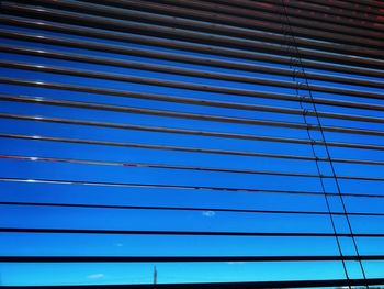 Full frame shot of metallic structure against blue sky