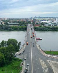 High angle view of vehicles on road against sky