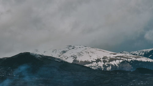 Snow covered mountain against sky
