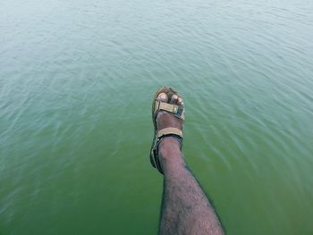 Low section of woman in water