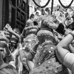 Women with kalash on head during jagannath temple mangal kalash yatra, indian hindu devotees