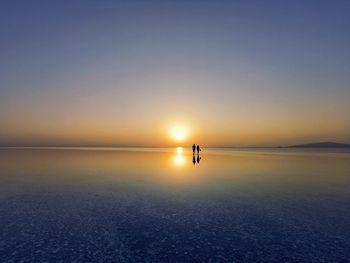 Scenic view of sea against clear sky during sunset