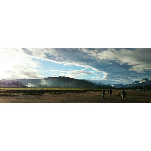 sky, mountain, landscape, tranquil scene, scenics, tranquility, beauty in nature, cloud - sky, transfer print, nature, copy space, mountain range, auto post production filter, cloud, field, non-urban scene, weather, cloudy, day