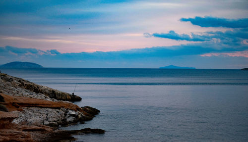 Scenic view of sea against sky at sunset