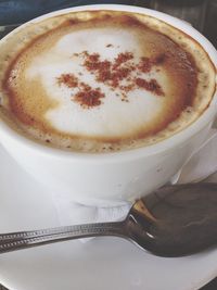 Close-up of cappuccino on table