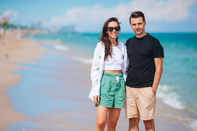 Young woman standing at beach
