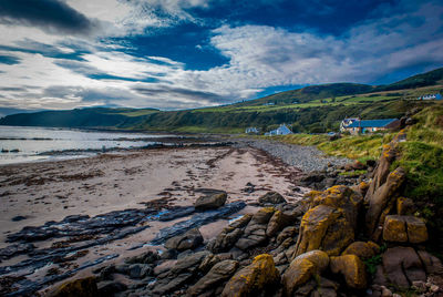 Scenic view of sea against cloudy sky