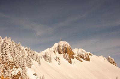 Scenic view of snow covered mountains against sky