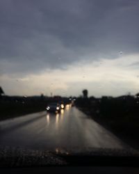 Road viewed through car windshield