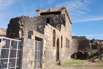 Low angle view of old building against sky