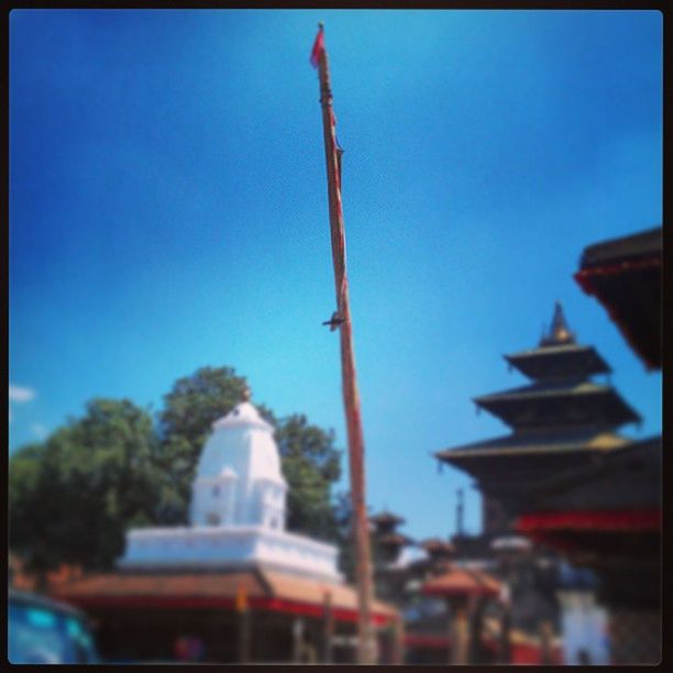 transfer print, clear sky, building exterior, built structure, architecture, auto post production filter, religion, blue, tree, place of worship, low angle view, spirituality, sky, selective focus, copy space, day, outdoors, focus on foreground, temple - building