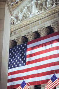 Low angle view of flag against the sky