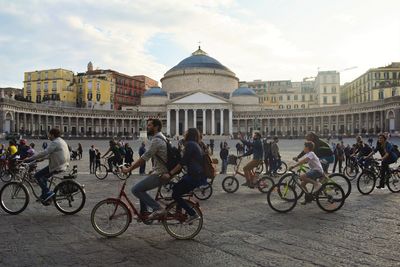 People riding bicycles at town square