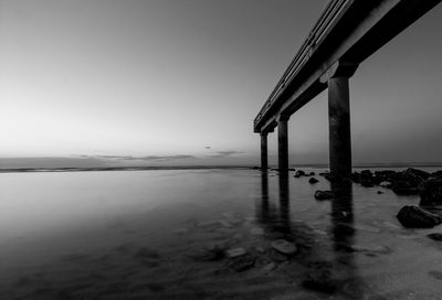 Pier over sea against clear sky