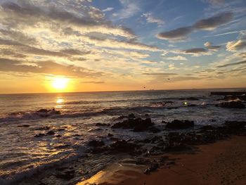 Scenic view of sea at sunset