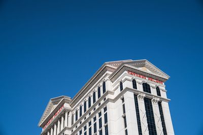 Low angle view of building against blue sky