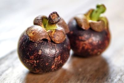 Close-up of mangosteens on table