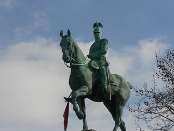 Low angle view of statue against sky