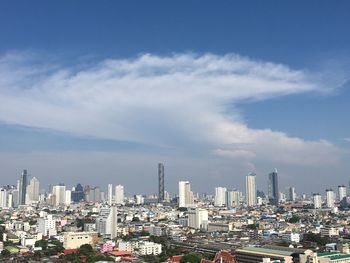 Modern buildings in city against sky