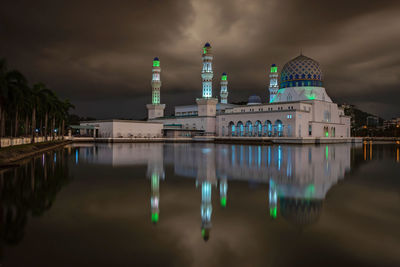 Reflection of illuminated buildings in water at night