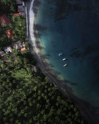 High angle view of people swimming in sea