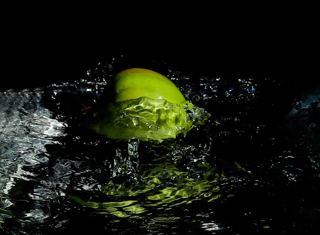 green, darkness, water, night, macro photography, no people, food and drink, nature, reflection, freshness, yellow, light, motion, black background, food, indoors, close-up, leaf, splashing, studio shot, healthy eating