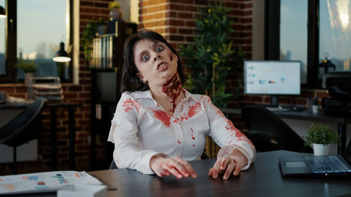 Portrait of young businesswoman working at office