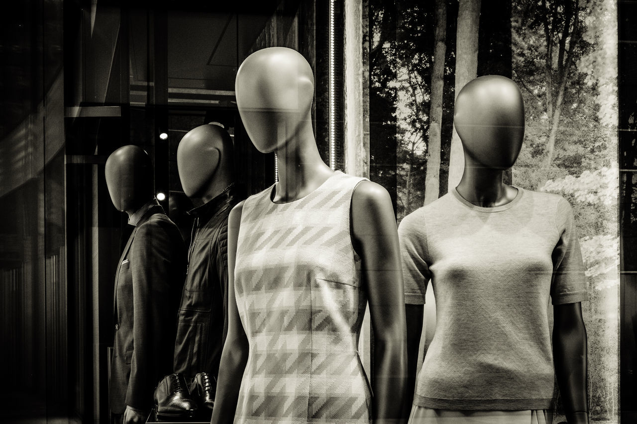 mannequin, human representation, representation, store, retail, clothing, shopping, retail display, day, fashion, window, standing, men, people, clothing store, side by side, rear view, male likeness, indoors, tree, boutique