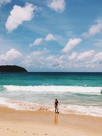 Man on beach against sky