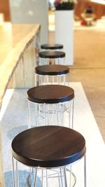 High angle view of empty chairs and table in cafe