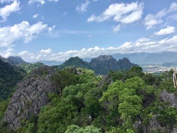 Scenic view of mountains against cloudy sky