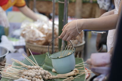 Midsection of woman preparing food