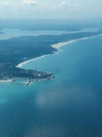 Aerial view of sea and island against sky