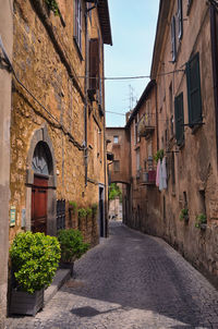 Narrow alley amidst buildings in city