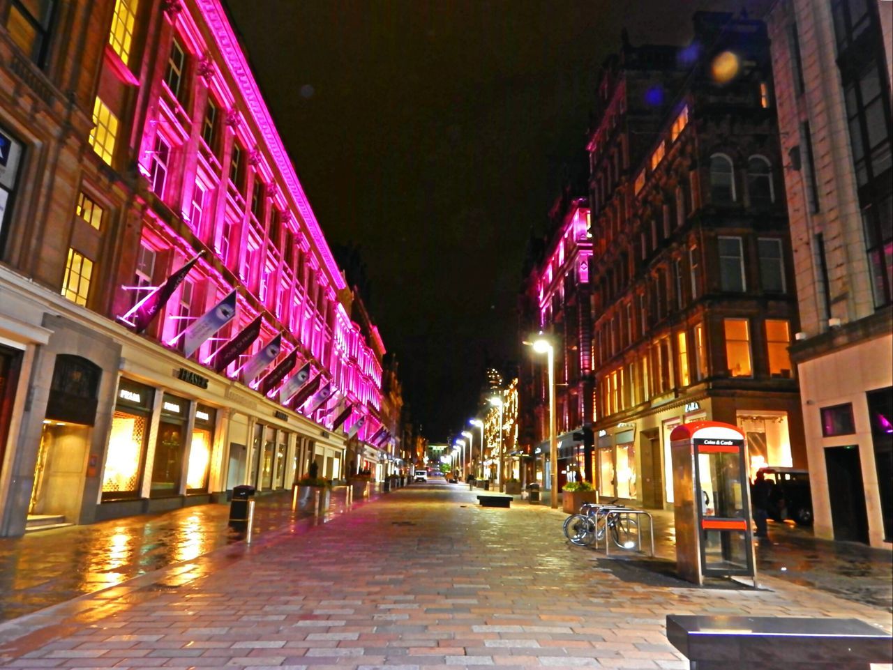 architecture, built structure, building exterior, illuminated, the way forward, night, diminishing perspective, street, lighting equipment, city, street light, building, alley, vanishing point, residential building, incidental people, empty, narrow, in a row, outdoors