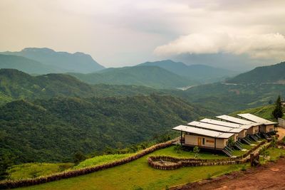 Scenic view of landscape and mountains against sky