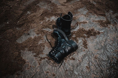 High angle view of black shoes on ground