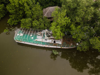 An aerial side view of an old abandoned ship