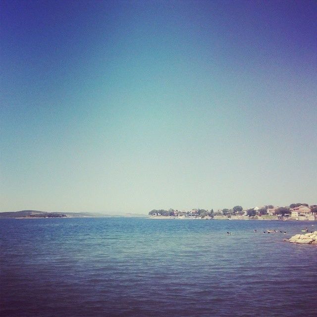 sea, water, copy space, waterfront, clear sky, blue, tranquil scene, tranquility, scenics, horizon over water, beauty in nature, nature, rippled, idyllic, seascape, outdoors, ocean, no people, calm, day