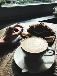 Close-up of coffee cup on table