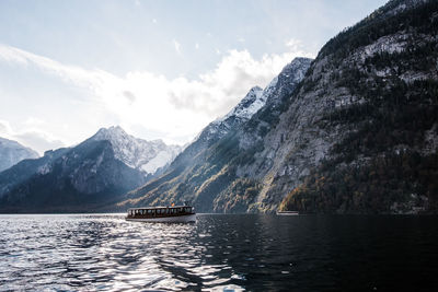 Scenic view of lake königssee with mountains against sky.