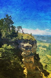 Scenic view of landscape against blue sky