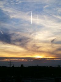 Silhouette landscape against sky during sunset