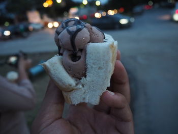 Midsection of person holding ice cream cone